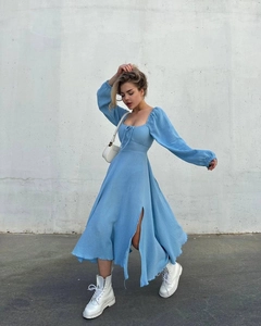 Detail of light blue square neck dress featuring front drawstring and high side slit design