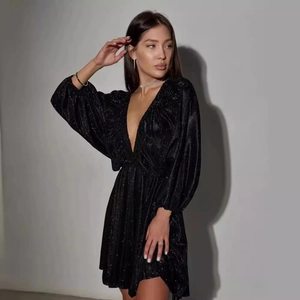 Elegant black sequin mini dress with deep V-neck, puff sleeves and a sparkling star effect