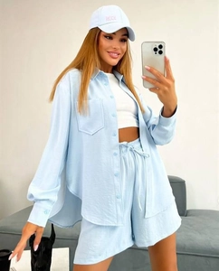 Detail of light blue linen-blend loose shirt and shorts set with a drawstring waist