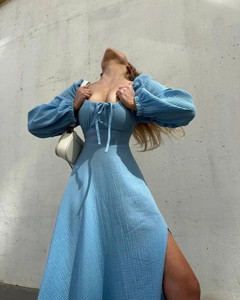 Detail of light blue square neck dress showing lace-up chest and crinkle texture fabric