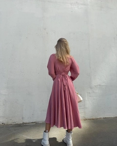 Rear view of a pink long sleeve dress with waist tie and waffle texture fabric