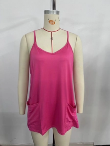 Detail view of rose pink V-neck camisole top featuring two large front patch pockets