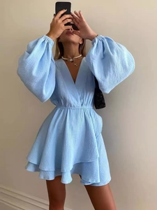 Fashionable light blue V-neck mini dress with lantern sleeves and ruffled hem in textured fabric