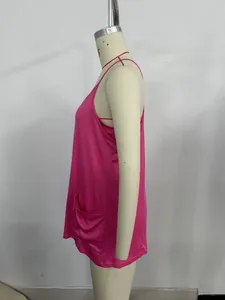 Detail view of rose pink camisole featuring silky fabric and side pocket detail