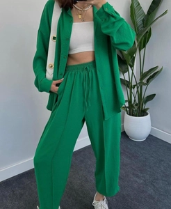 Detail of green women's casual set showing textured fabric and drawstring elastic waist