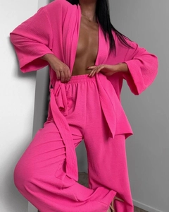 Detail of rose pink pajama set featuring pleated texture and kimono-style sleeves