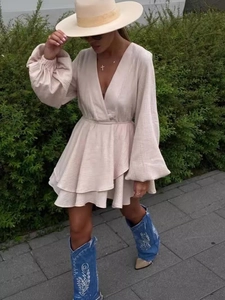 Chic beige V-neck boho mini dress with lantern sleeves and layered skirt for summer vacation
