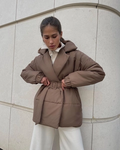 Detail of brown belted puffer coat with wide collar and waist-slimming silhouette