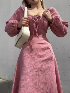 Pink square neck long sleeve dress with smocked texture and side slit detail