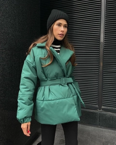 Detail of winter thick dark green cotton jacket featuring wide lapels and adjustable waist belt