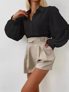 Elegant black long sleeve blouse with lace hollow-out design and high-waist shorts set