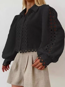 Elegant black long sleeve lantern shirt with intricate geometric lace cutouts and lapel collar