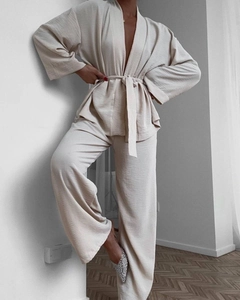Detail showing the textured fabric and waist tie on this beige loungewear set for women