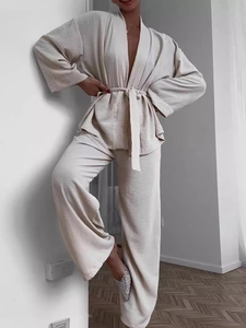 Women's beige pleated two-piece loungewear set with kimono top and wide-leg trousers