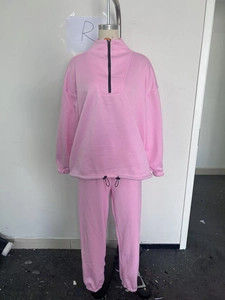 Pink two-piece tracksuit set featuring a half-zip stand collar sweatshirt and joggers