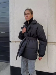 Women's chic black winter padded coat with high collar, quilted texture and waist belt