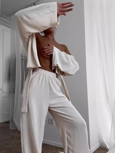 Women's off-white pleated loungewear set with loose long sleeves and wide leg pants