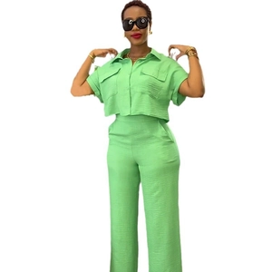 Women's 2-piece lime green set with short sleeve crop shirt and high waist wide leg pants