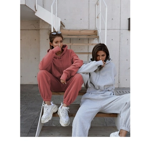 Close-up of oversized cotton hoodie with kangaroo pocket and matching sweatpants set