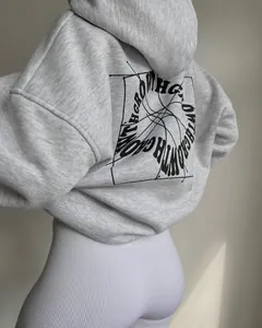 Detail view of light grey hoodie back featuring black GROW WITH THE FLOW artistic print