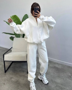 Detail of white oversized fleece tracksuit with high collar jacket and jogger pants