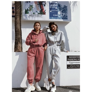 Detail of grey and pink women's tracksuit with drawstring hoodie and jogger pants set