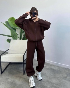 Detail of dark brown hooded tracksuit with drop-shoulder zipper top and joggers