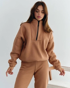 Detail view of heavy cotton tracksuit featuring stand collar zipper and ribbed elastic cuffs