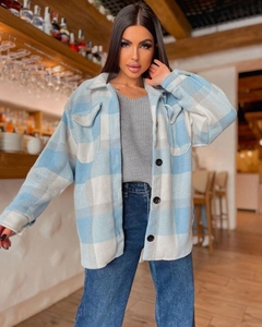 Detail of blue and white plaid flannel shirt jacket with dual chest flap pockets