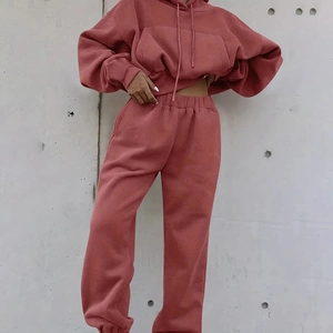 Detail of dusty rose two-piece hoodie and sweatpants set with soft knit texture