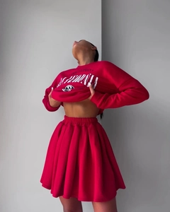 Detail view of the red sweatshirt texture and white American Street graphic printing