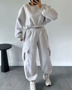 Detail of grey two-piece lounge set with cropped sweatshirt and cargo joggers pants
