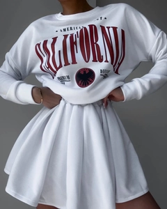 Detail of white American vintage fleece sweatshirt with red California eagle print and skirt