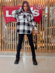 Women's casual plaid button-down long sleeve shacket with front flap pockets and lapel