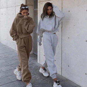 Close-up detail of oversized hoodie and high-waist joggers in premium cotton set