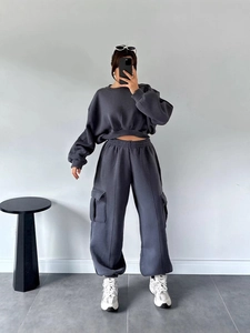Women's dark gray two-piece set featuring cropped sweatshirt and high-waist cargo sweatpants