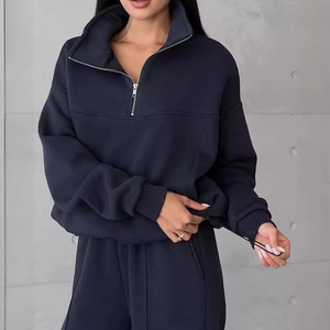 Navy blue two-piece sportswear set with half-zip sweatshirt and drawstring hem joggers