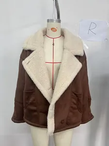Detail of vintage brown suede jacket featuring warm faux shearling lining and large cargo pockets