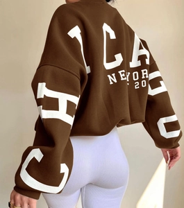 Detailed back view of oversized brown hoodie with Chicago New York letter print