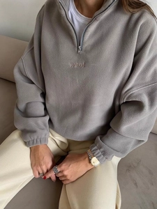 Women's loose grey half-zip fleece sweatshirt with embroidered want lettering and stand collar