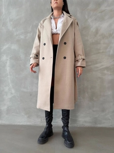 Elegant beige wool blend long coat with double-breasted black buttons and wide lapels