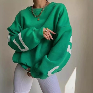 Women's bright green oversized sweatshirt featuring white geometric sleeve prints