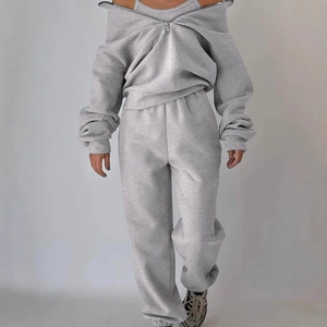 Women's grey two-piece fleece tracksuit featuring a zip collar sweatshirt and joggers