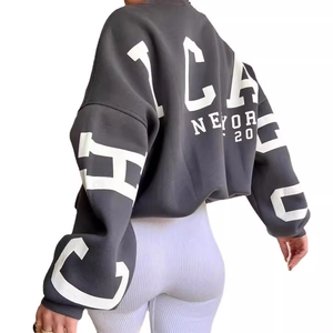 Oversized dark grey sweatshirt with white Chicago and New York lettering on back