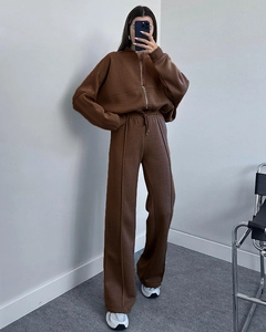 Deep brown two-piece tracksuit featuring zip-up hoodie and high-waisted wide-leg sweatpants