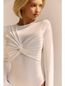 Detailed view of the knotted pleats and soft texture on white long sleeve bodysuit