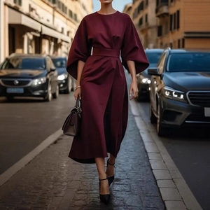 Elegant burgundy midi dress with puff sleeves and waist belt in a European street style