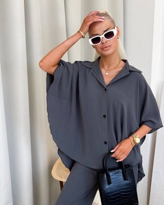 Detail view of dark grey texture fabric on women's oversized shirt and wide leg pants set