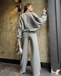 Detail of grey oversized hoodie and wide-leg trousers set in comfortable cotton fabric