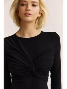 Detail of elegant black long sleeve bodysuit featuring a ruched knot front design